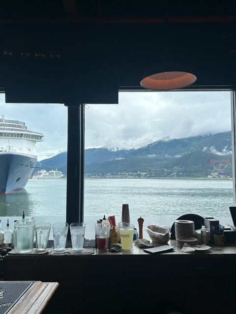 Cruise ship deck view of Alaska mountains and water