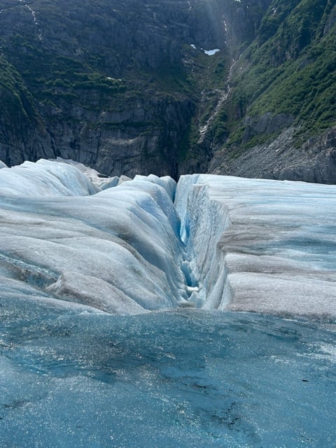 Deep blue crevasse in an Alaska glacier