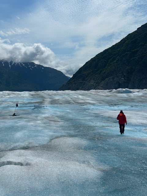 Hikers crossing a broad Alaska glacier