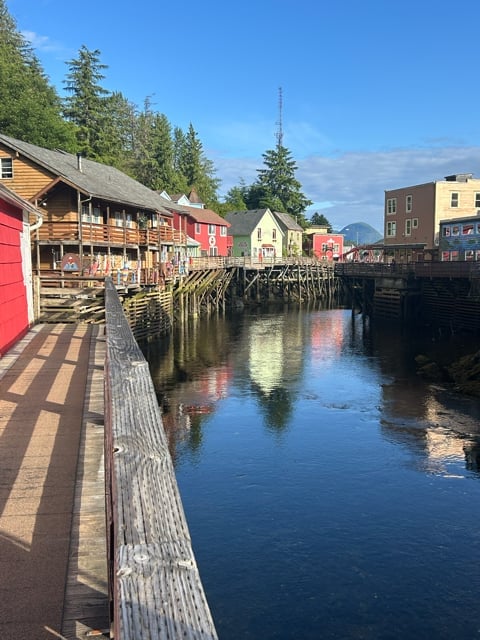 Ketchikan waterfront boardwalk reflected in calm water