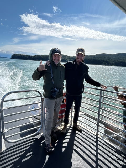 Travelers standing on an Alaska boat deck