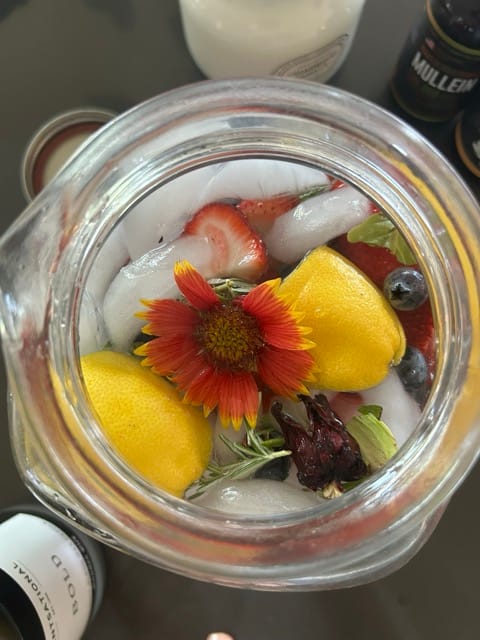 Bowl of harvested tomatoes and flowers