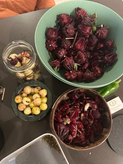 Small plates with preserved garden snacks and roselle