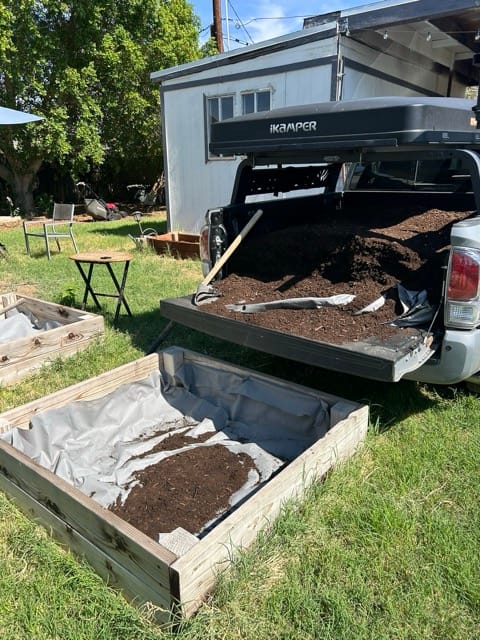 Outdoor grill with tray of garden food