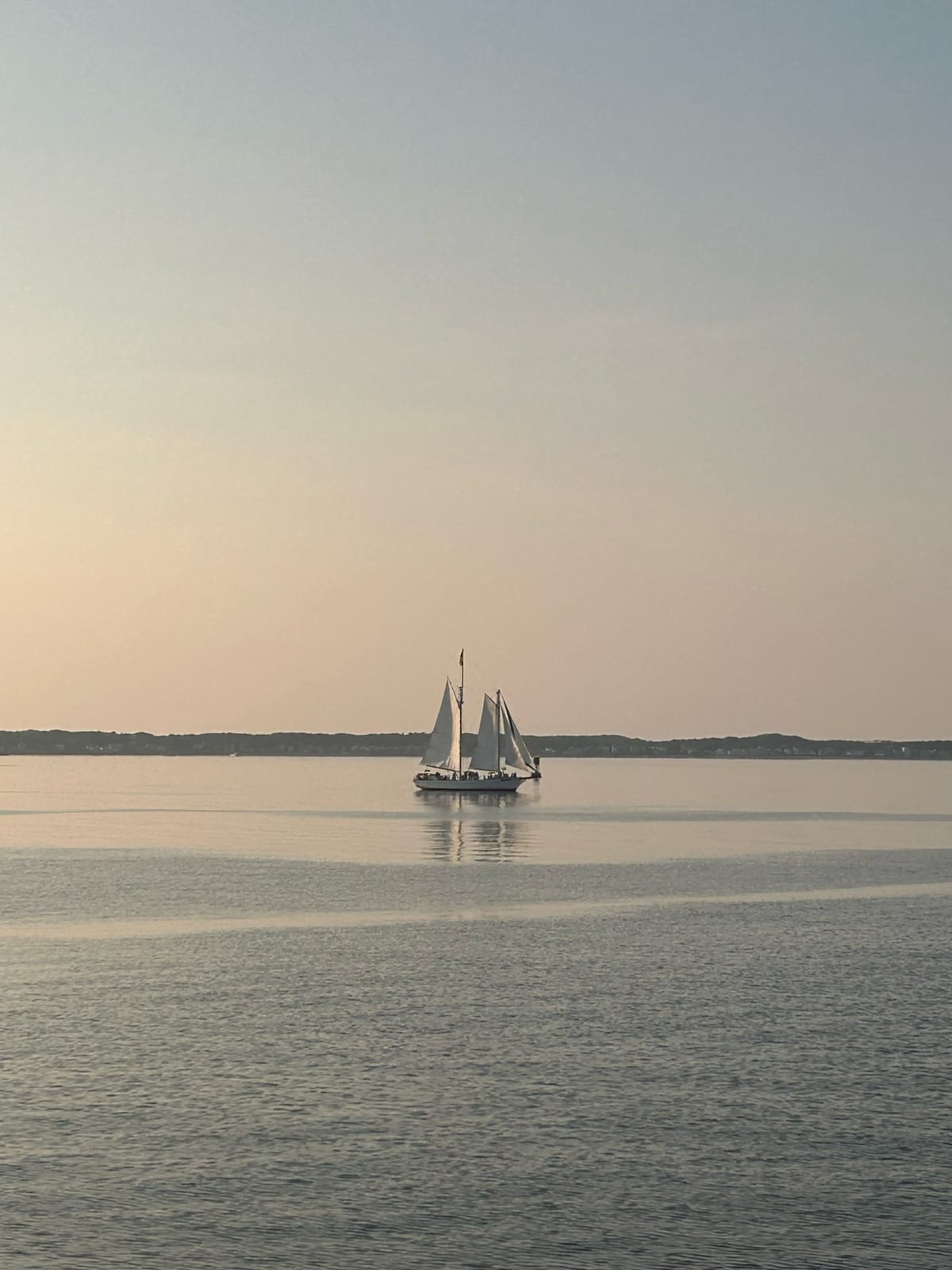 cape cod bay sailboat golden hour calm in Massachusetts