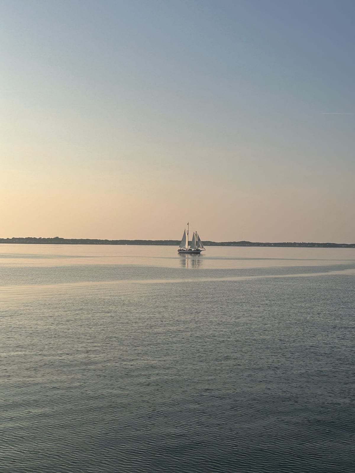 cape cod bay sailboat sunset reflection calm in Massachusetts