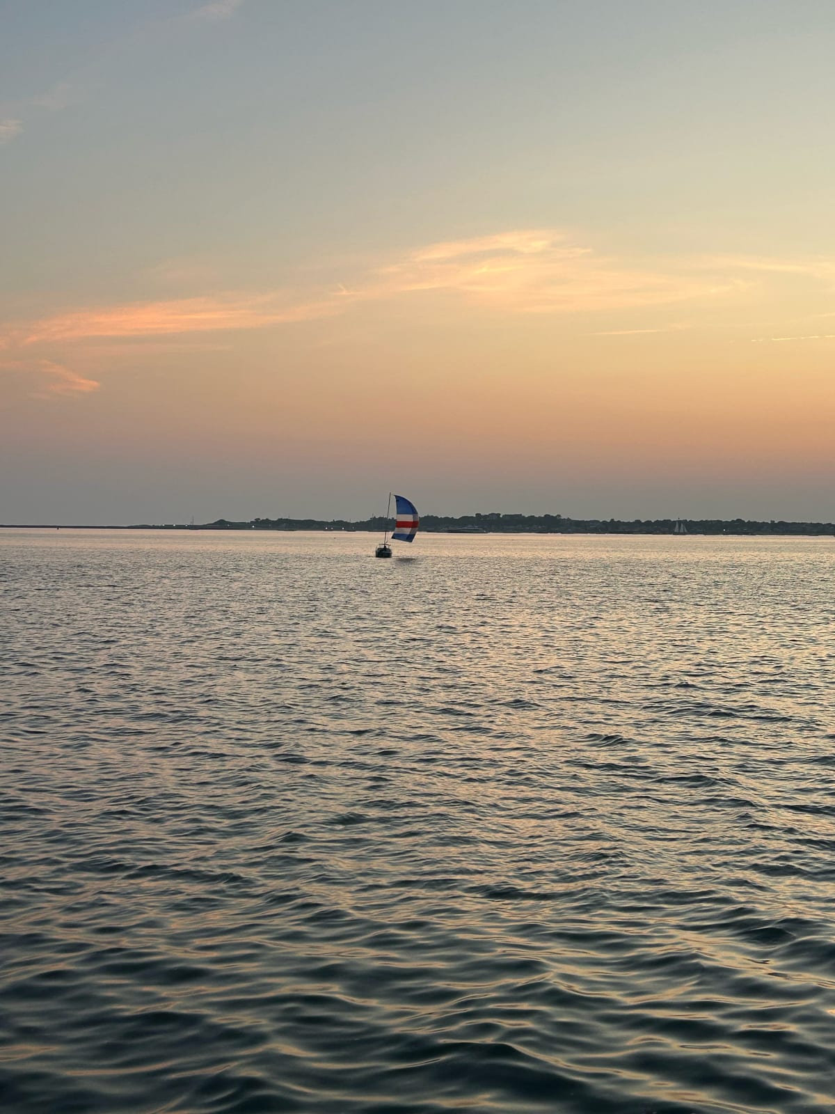 cape cod bay windsurfer sunset reflection in Massachusetts
