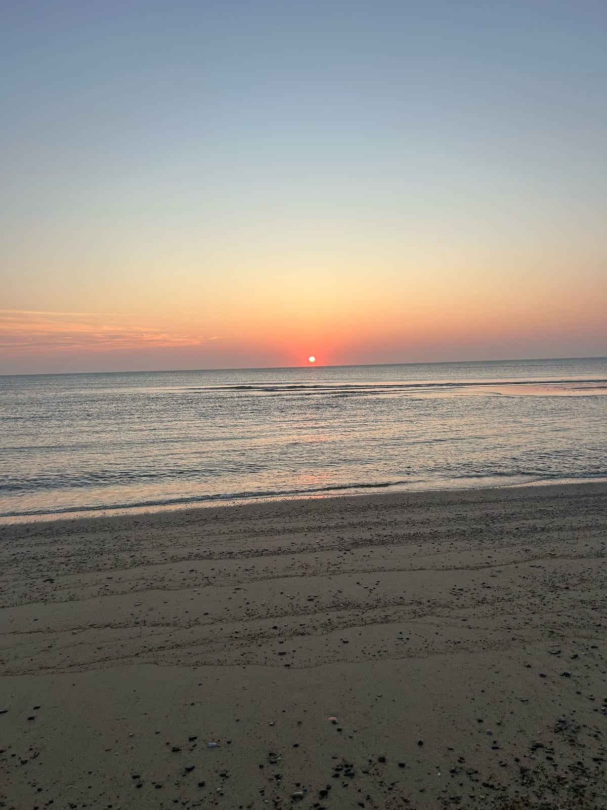 cape cod beach sunset footprints sand in Massachusetts