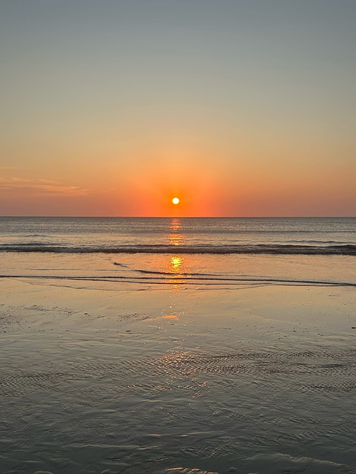 cape cod beach sunset orange sky reflection in Massachusetts