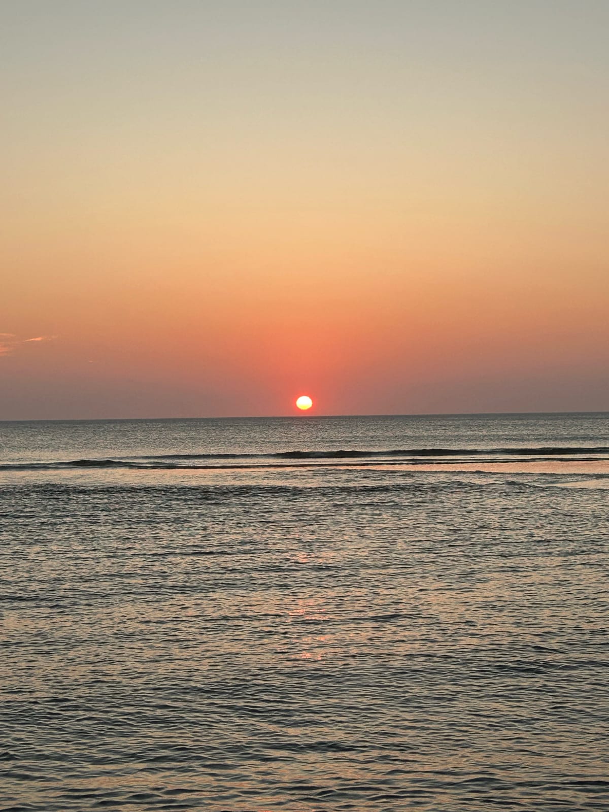 cape cod beach sunset sun disk horizon in Massachusetts