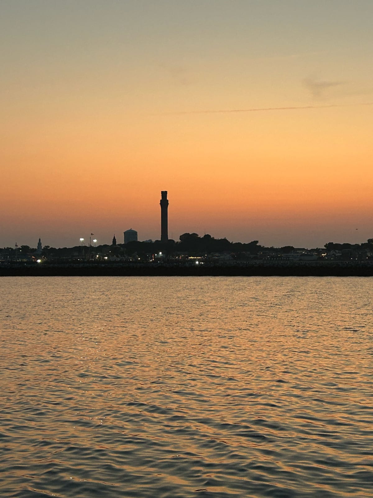 provincetown pilgrim monument sunset harbor in Massachusetts